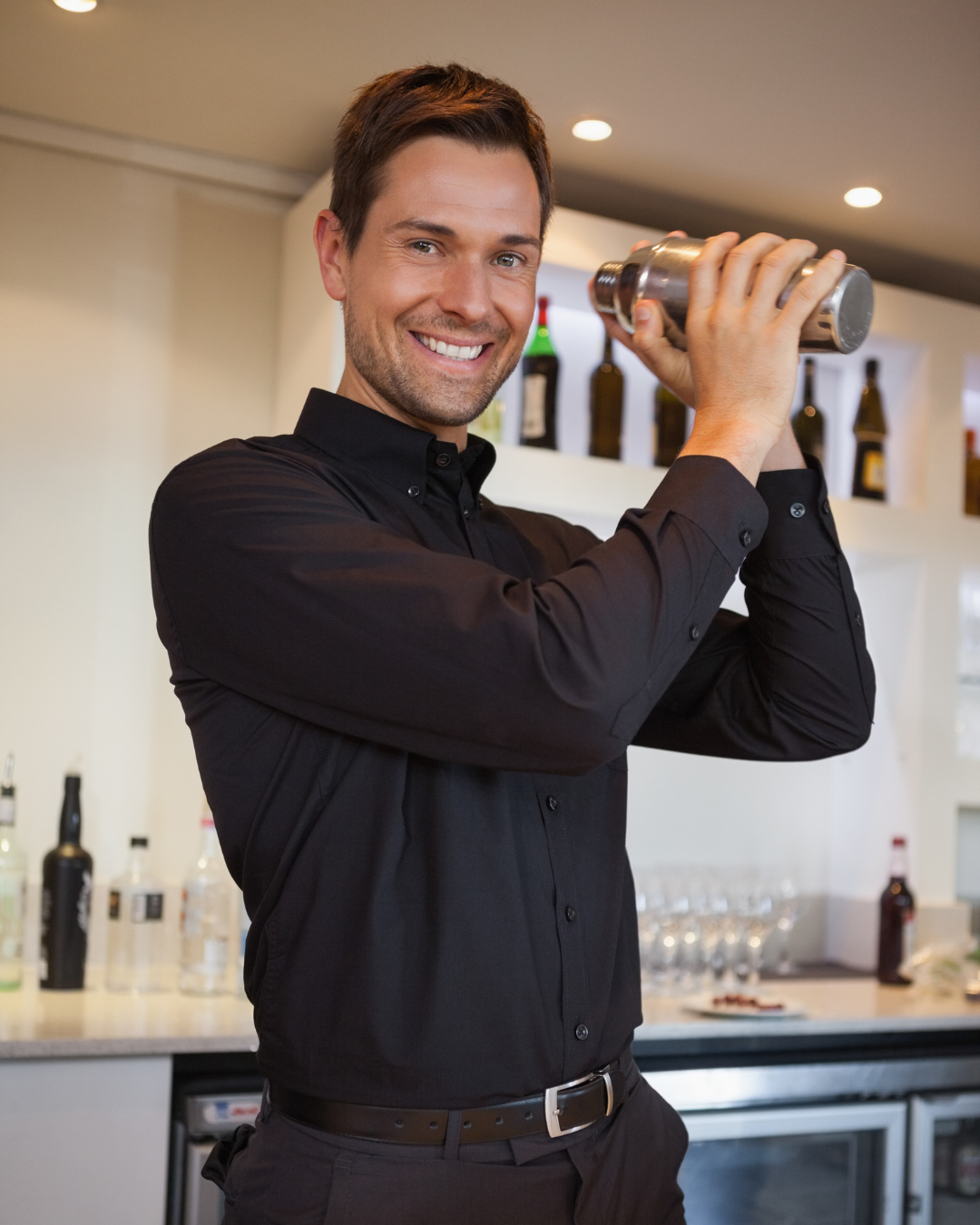 Bartender stirring a negroni cocktail